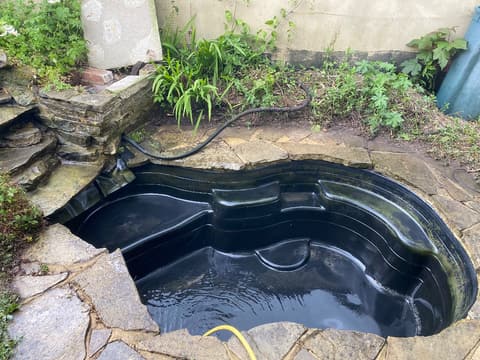 The same Maidstone pond after, cleaned out and filling with fresh water