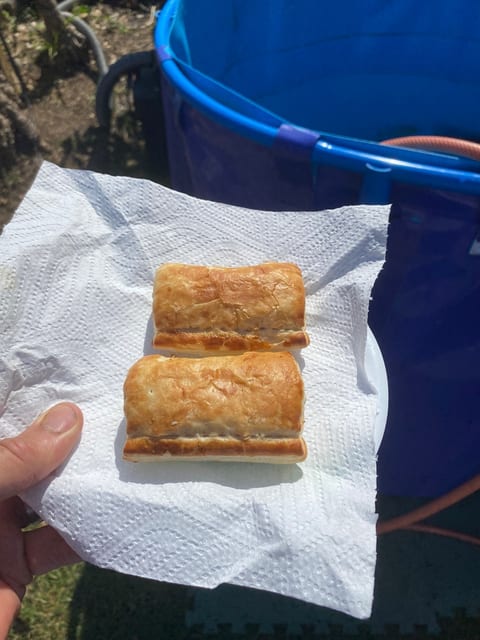 Two warm sausage rolls from the customer on a pond cleaning job